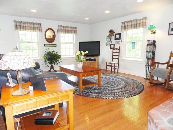 61 Coldbrook Road Oakham, MA 01068 - Photo 6 of 30 a living room with fireplace furniture and a large window