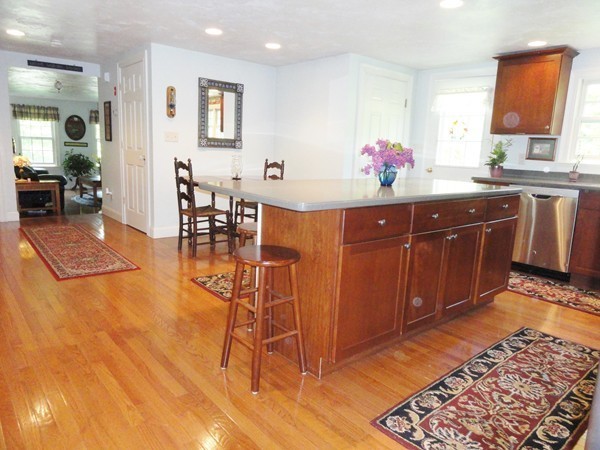 61 Coldbrook Road Oakham, MA 01068 - Photo 9 of 30 a kitchen with stainless steel appliances granite countertop a sink dishwasher and cabinets with wooden floor