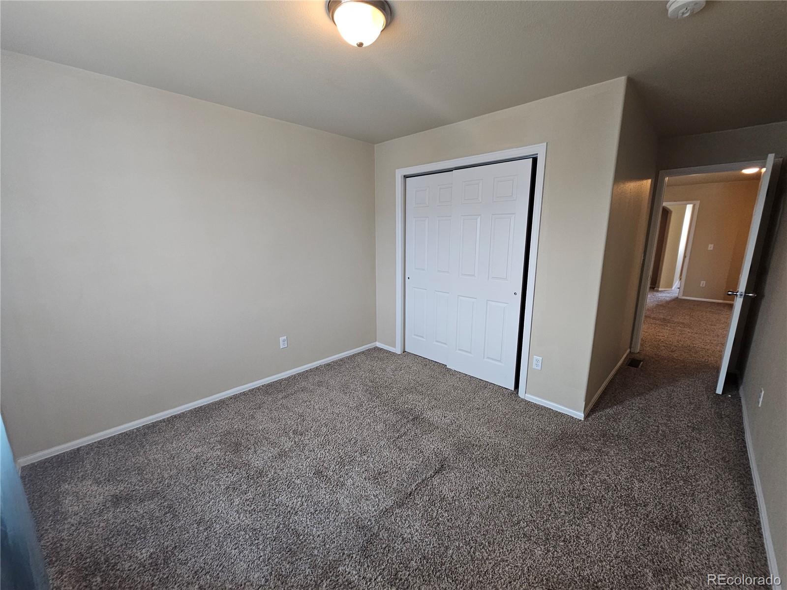 5352 Canadian Rose View Colorado Springs, CO 80916 - Photo 11 of 16 an empty room with a mirror
