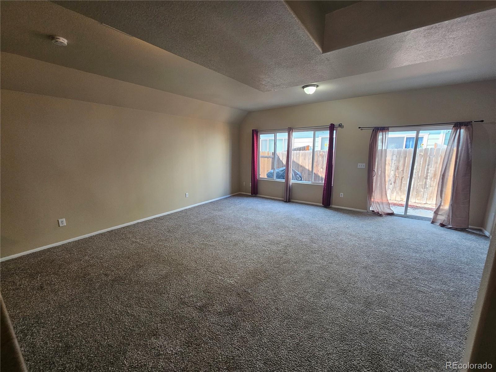 5352 Canadian Rose View Colorado Springs, CO 80916 - Photo 2 of 16 a view of empty room with windows