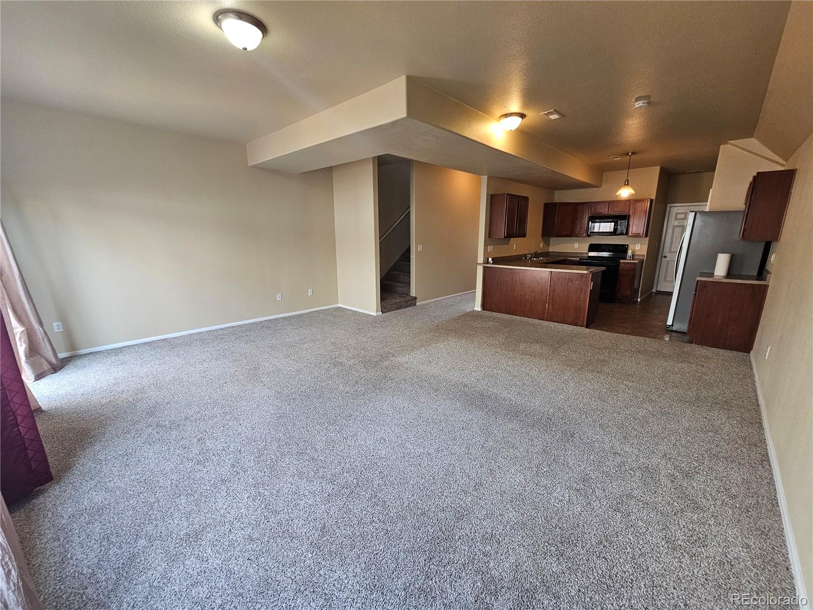 5352 Canadian Rose View Colorado Springs, CO 80916 - Photo 4 of 16 a view of a kitchen with a sink