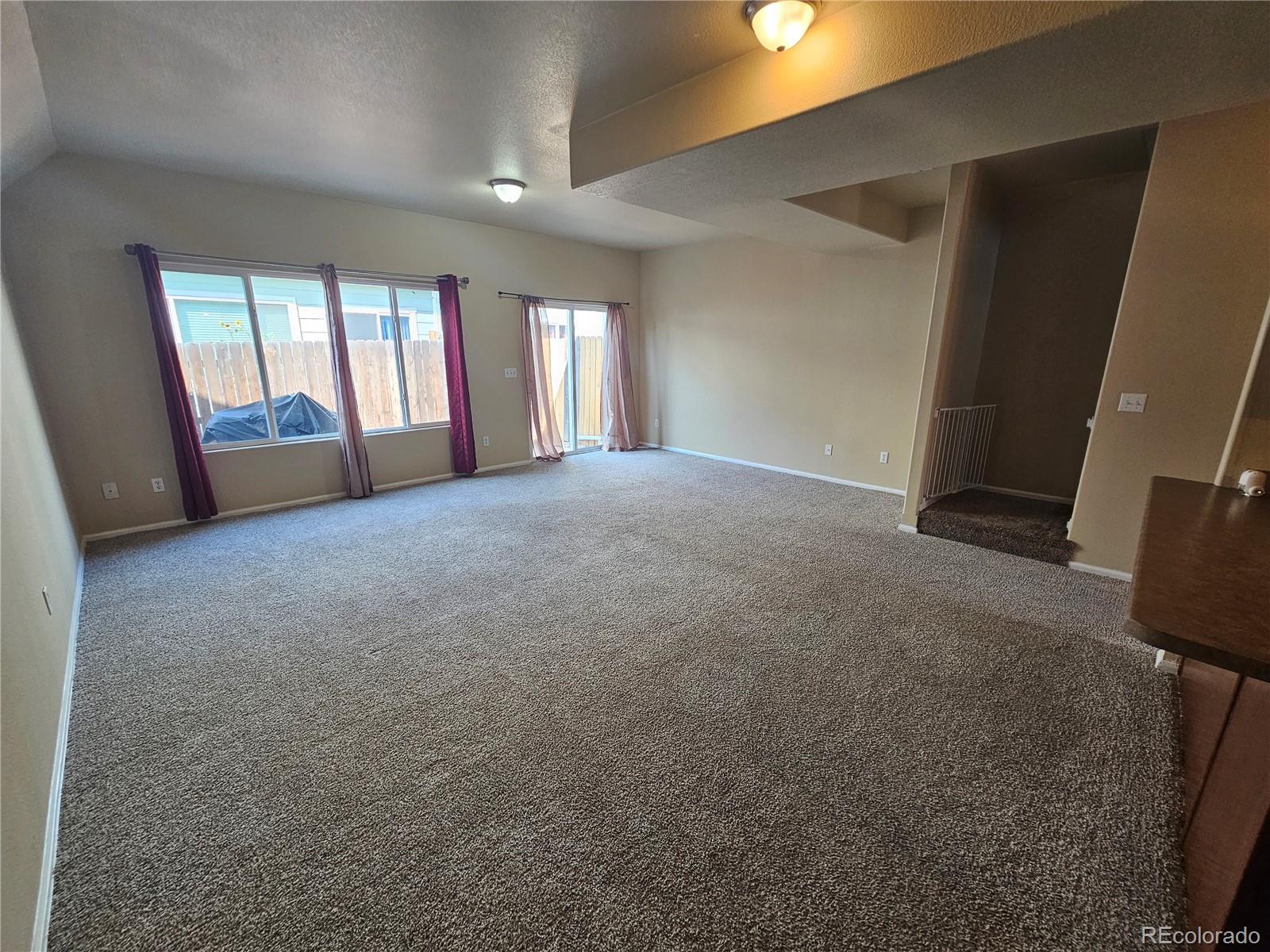 5352 Canadian Rose View Colorado Springs, CO 80916 - Photo 5 of 16 a view of an empty room with a window