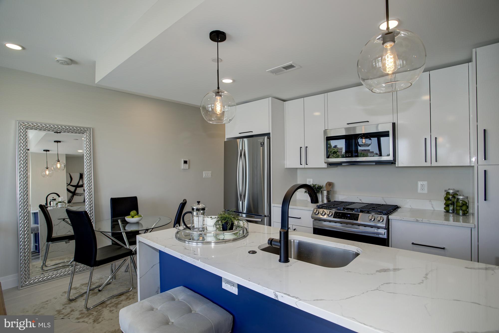 2301 Ontario Road Northwest, Unit 301 Washington, DC 20009 - Photo 3 of 17 with island perfect for entertaining