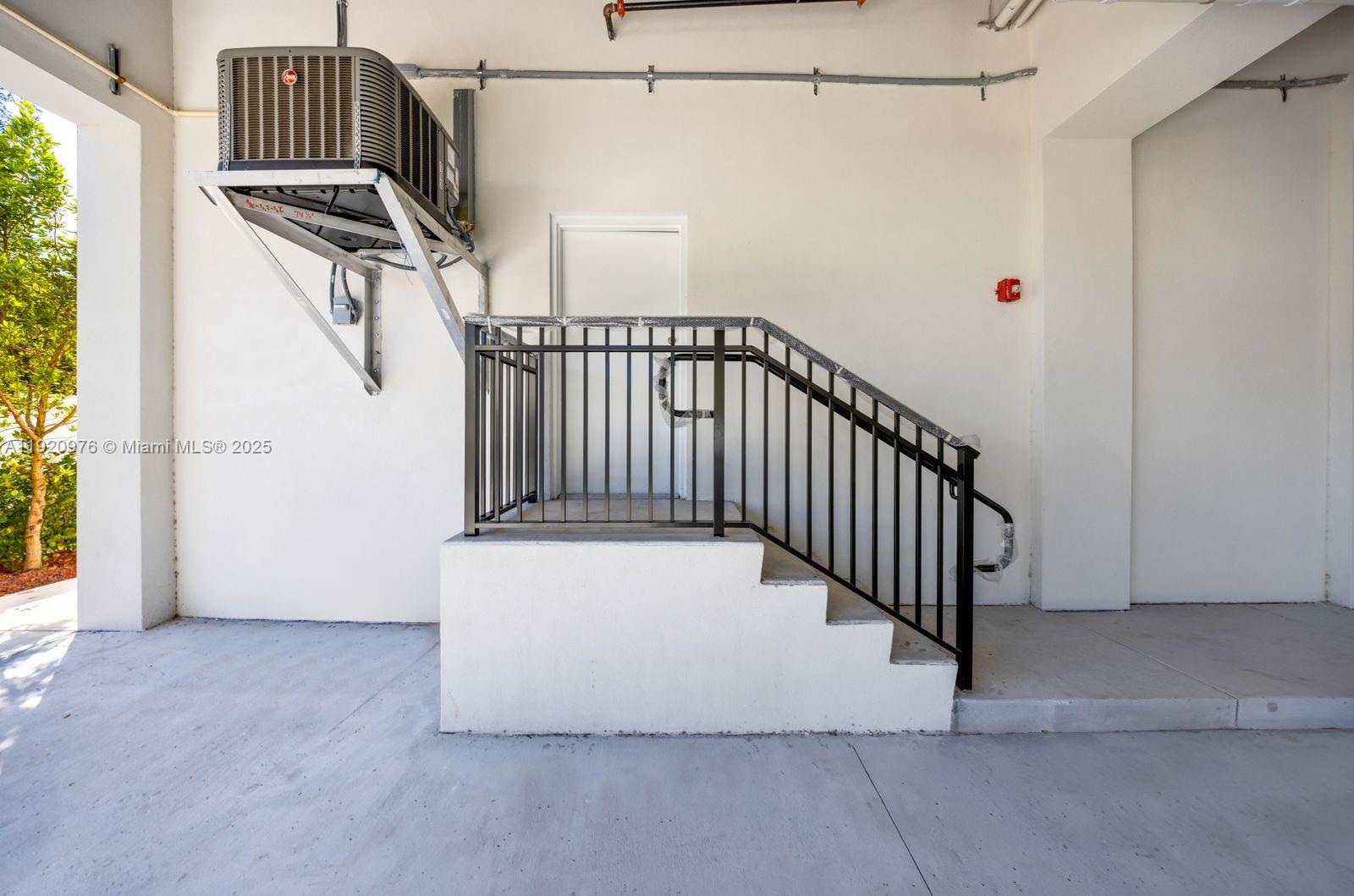 20 Northeast 19th Avenue, Unit 101 Pompano Beach, FL 33060 - Photo 17 of 17 a view of a hallway with staircase