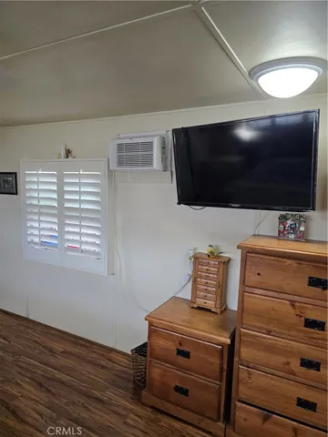 a room with furniture and a flat screen tv