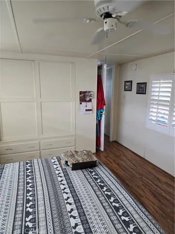 a bedroom with bed and a rug