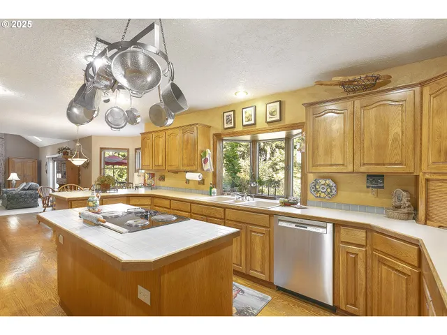 a kitchen with a sink a stove and cabinets