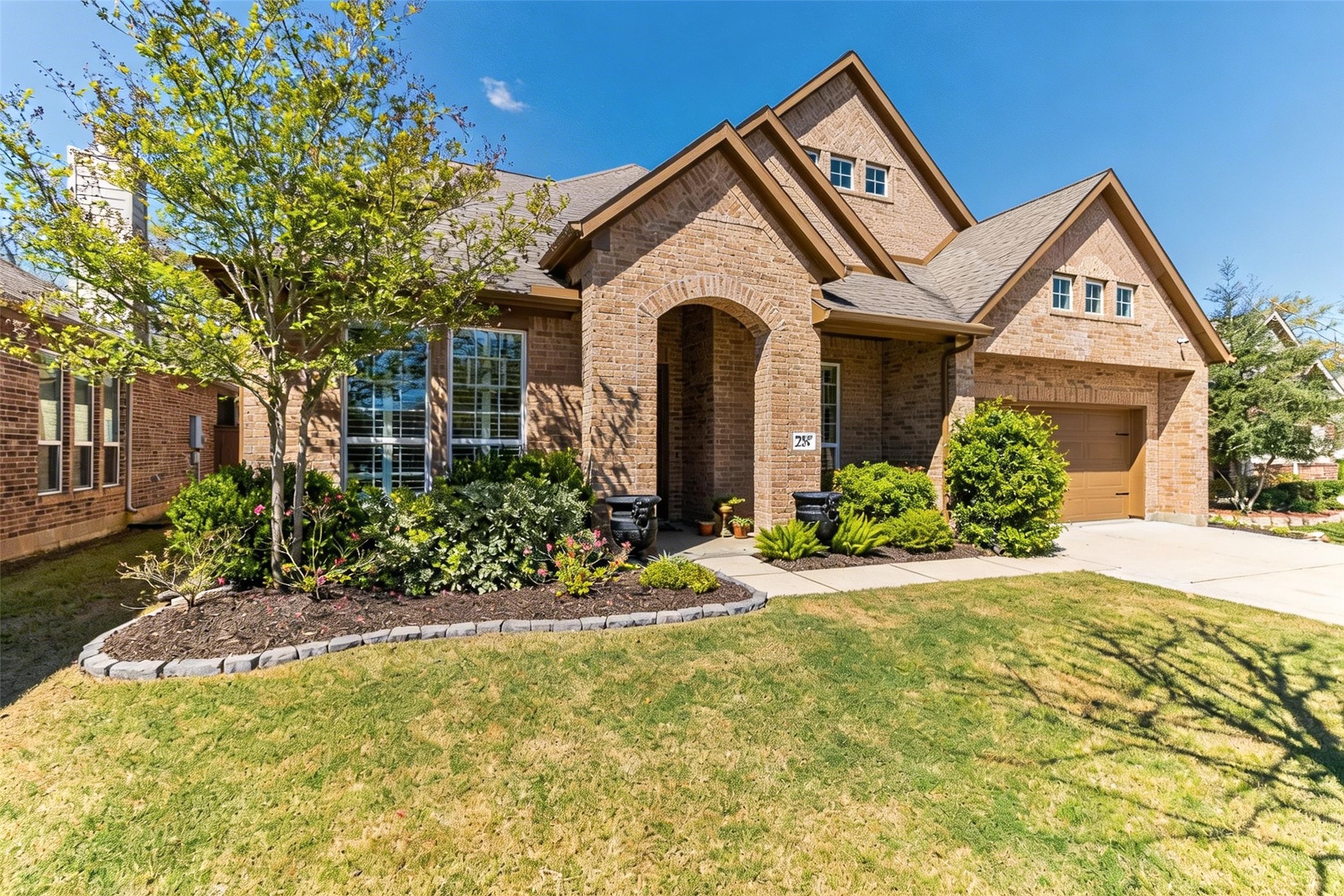 a front view of a house with a yard