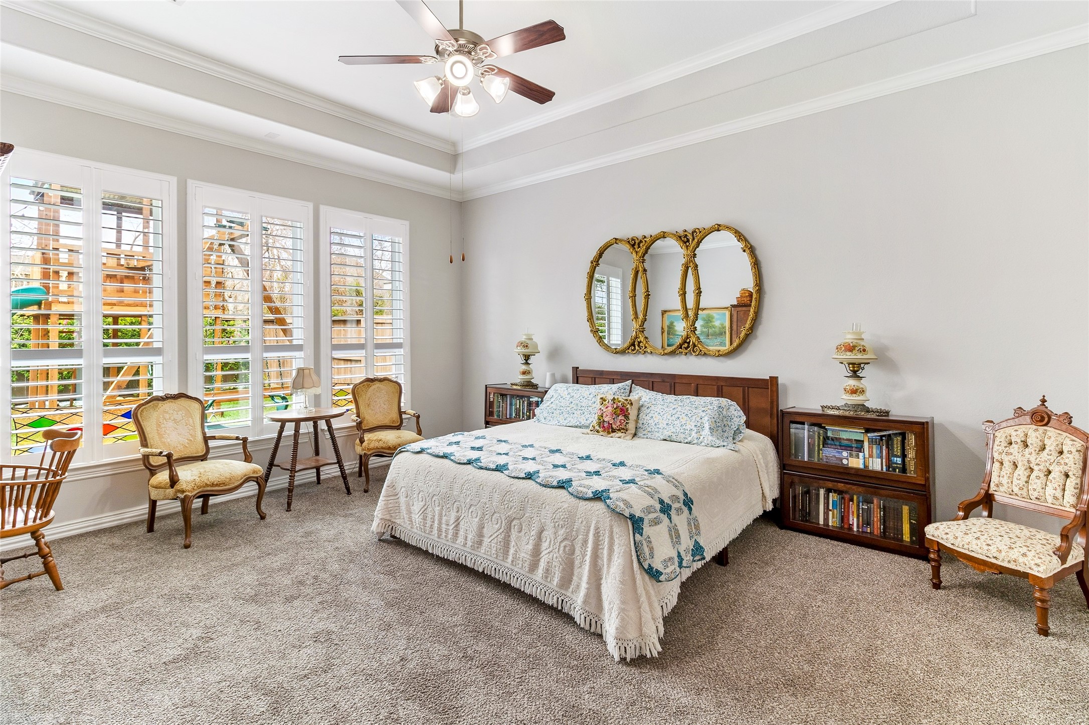 208 Woodside Court Clute, TX 77531 - Photo 11 of 38 a bedroom with a bed and a chandelier