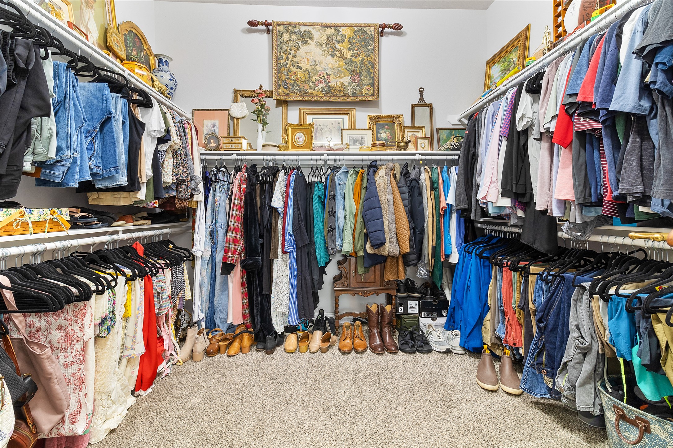 208 Woodside Court Clute, TX 77531 - Photo 13 of 38 a view of walk in closet with clothes