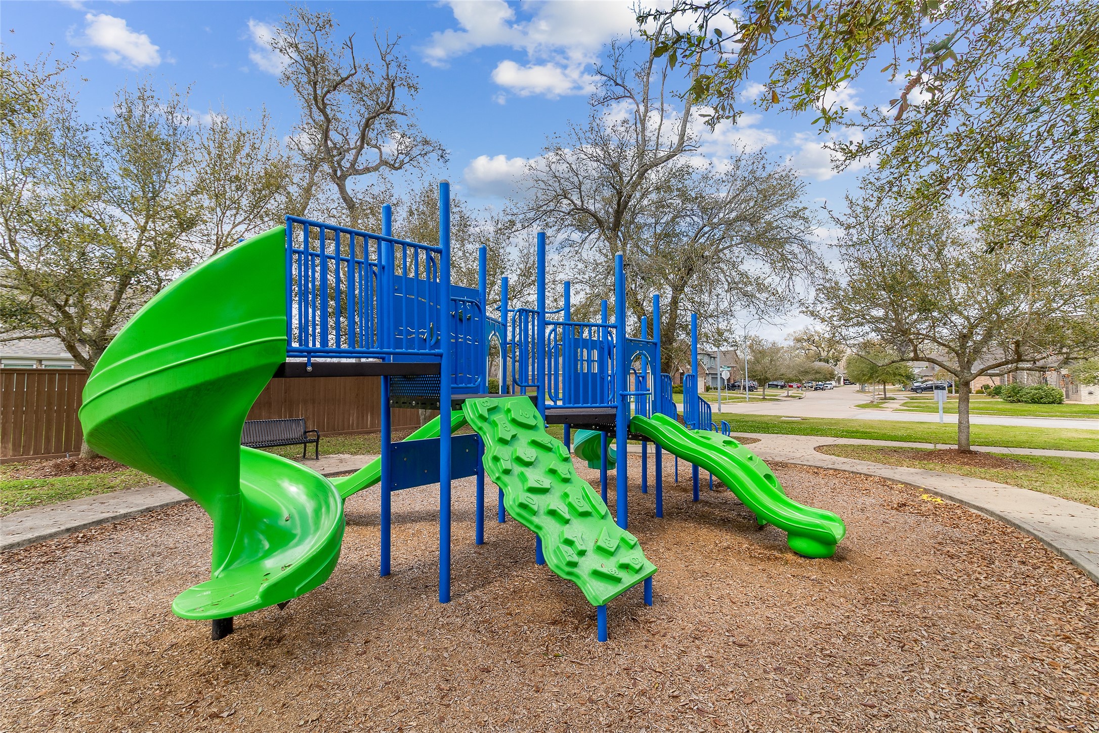 208 Woodside Court Clute, TX 77531 - Photo 27 of 38 a view of a park with iron fence