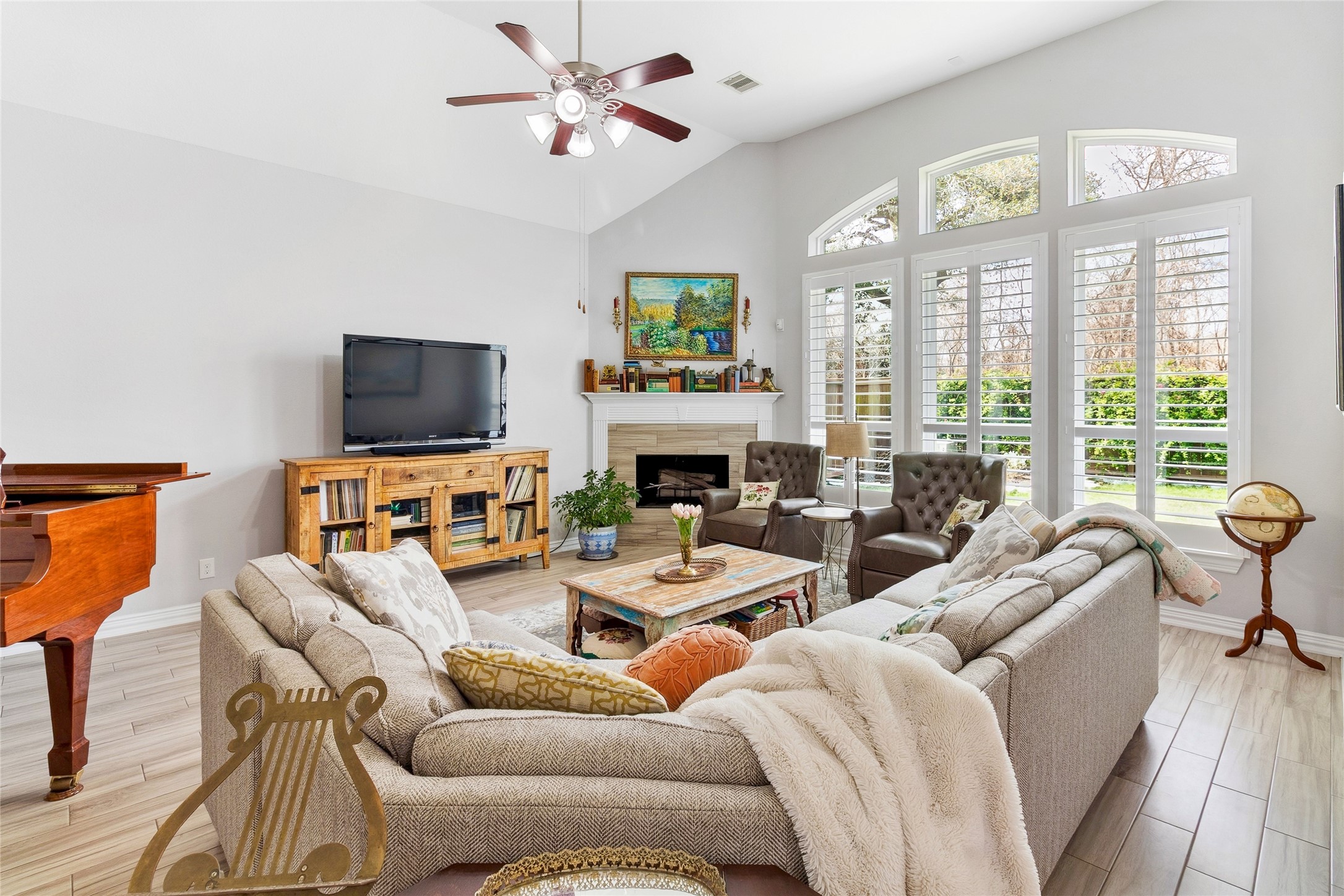 208 Woodside Court Clute, TX 77531 - Photo 6 of 38 a living room with furniture a fireplace and a flat screen tv