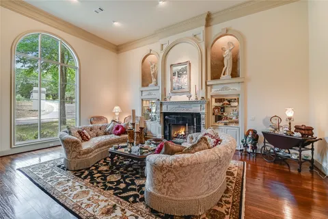 a view of a livingroom with furniture window and wooden floor