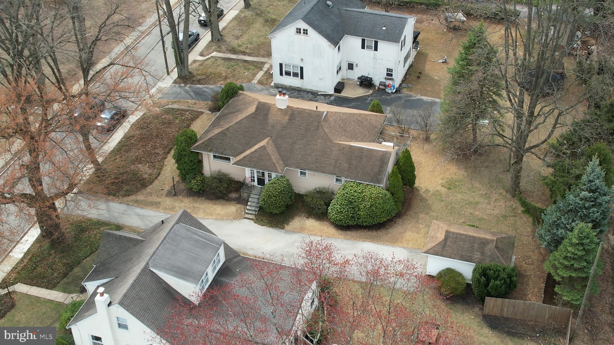 150 Hart Lane Springfield, PA 19064 - Photo 1 of 49 an aerial view of a house with garden space and a building