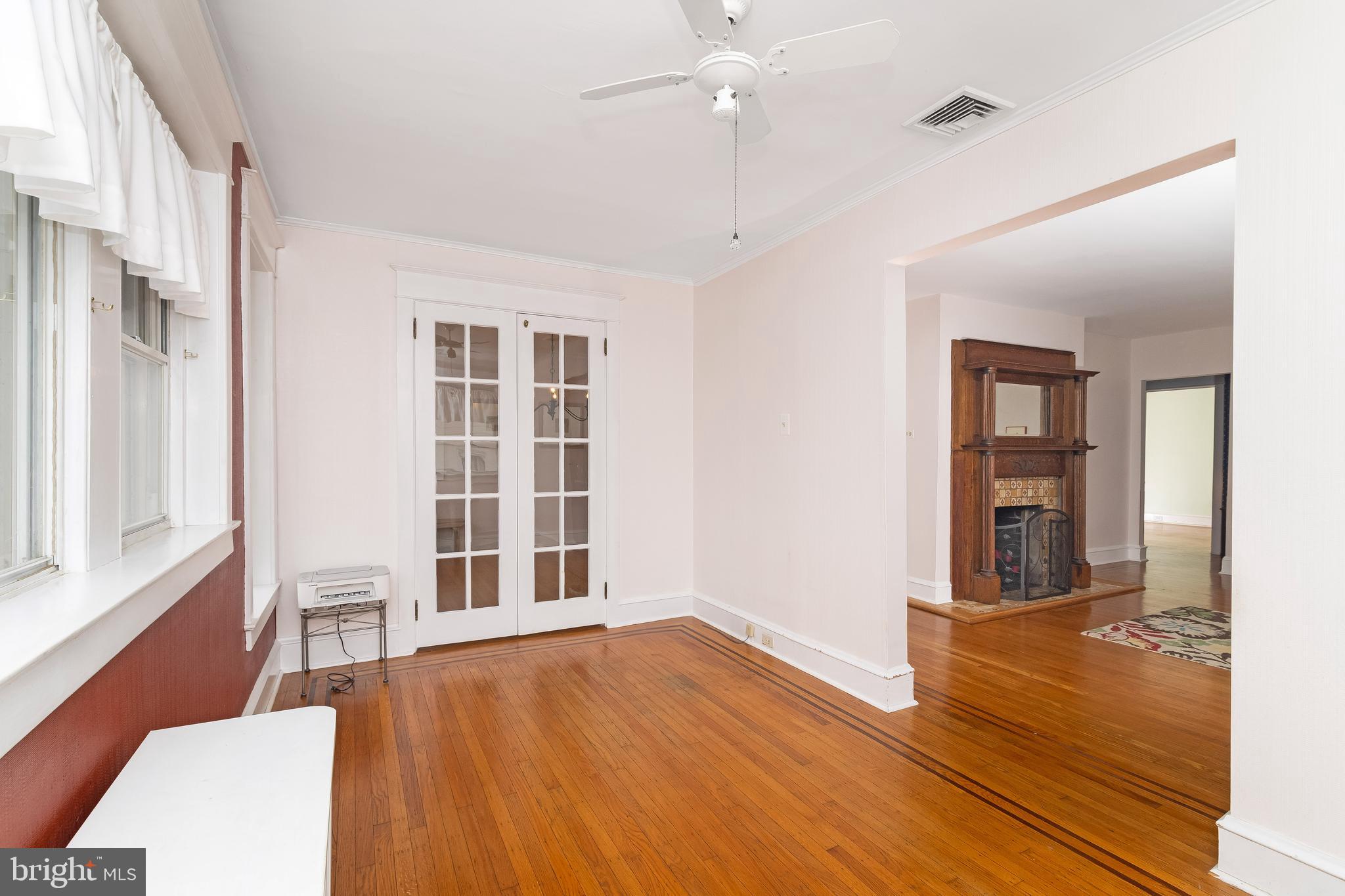 150 Hart Lane Springfield, PA 19064 - Photo 13 of 49 a view of an empty room with wooden floor and a window
