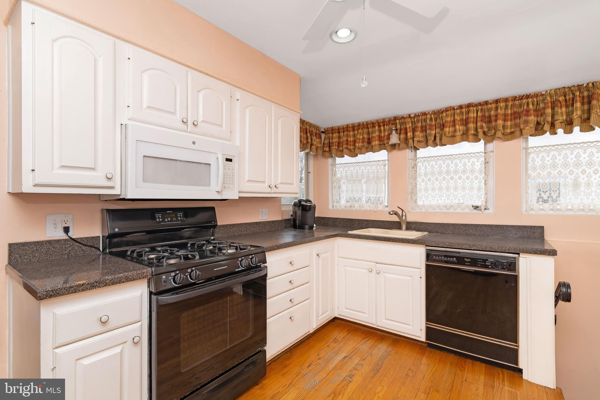 150 Hart Lane Springfield, PA 19064 - Photo 19 of 49 a kitchen with granite countertop white cabinets and appliances
