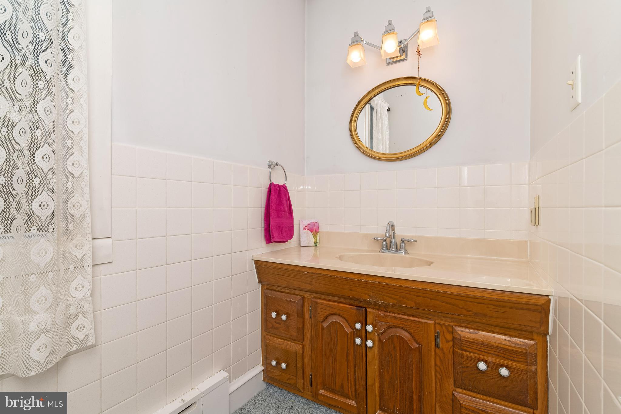 150 Hart Lane Springfield, PA 19064 - Photo 27 of 49 a bathroom with a sink and a mirror