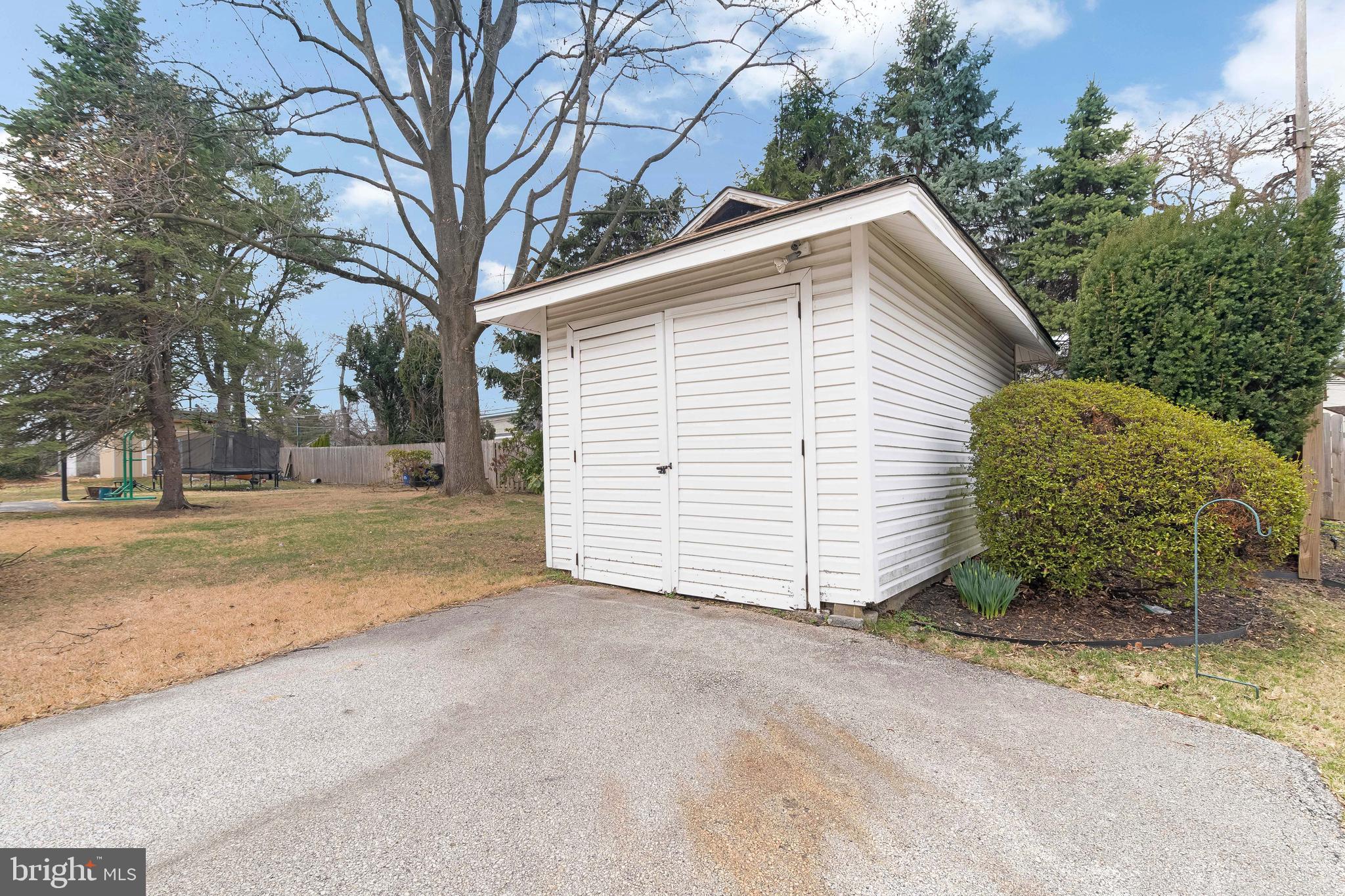 150 Hart Lane Springfield, PA 19064 - Photo 45 of 49 a view of a house with a yard and garage