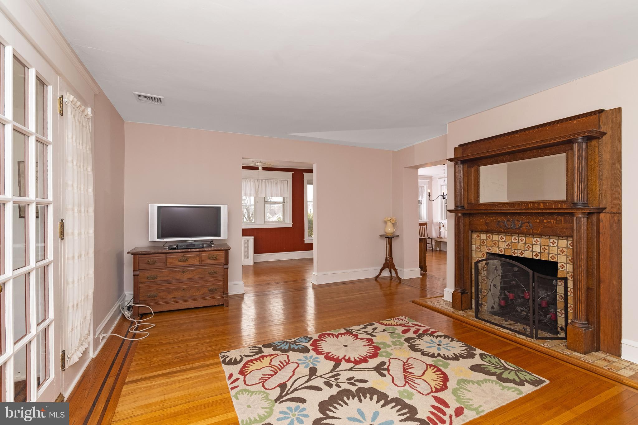 150 Hart Lane Springfield, PA 19064 - Photo 7 of 49 a living room with furniture rug and a fireplace