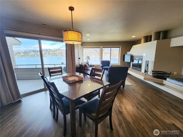 a view of a dining room with furniture window and wooden floor