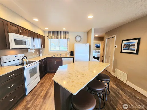 a kitchen with a table and chairs in it