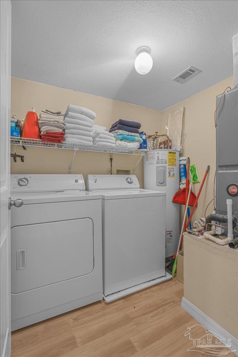 4831 East Olive Road, Unit 1D Pensacola, FL 32514 - Photo 28 of 36 a utility room with dryer and washer