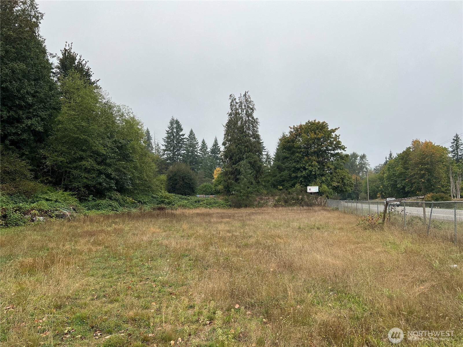 20045 Renton-Maple Valley Road Renton, WA 98058 - Photo 12 of 14 a view of a field with trees in the background