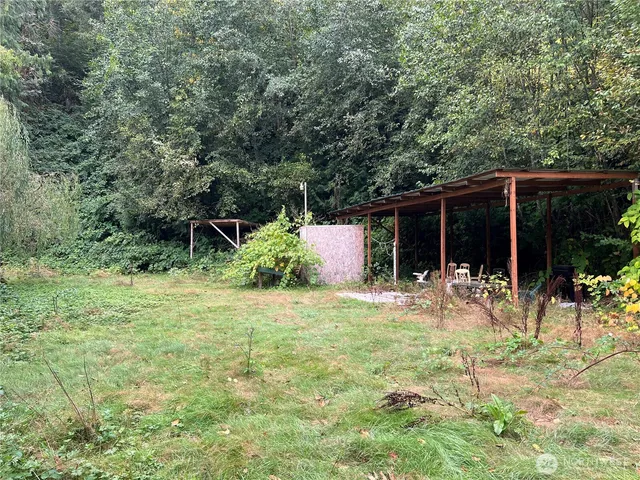 a backyard of a house with seating space