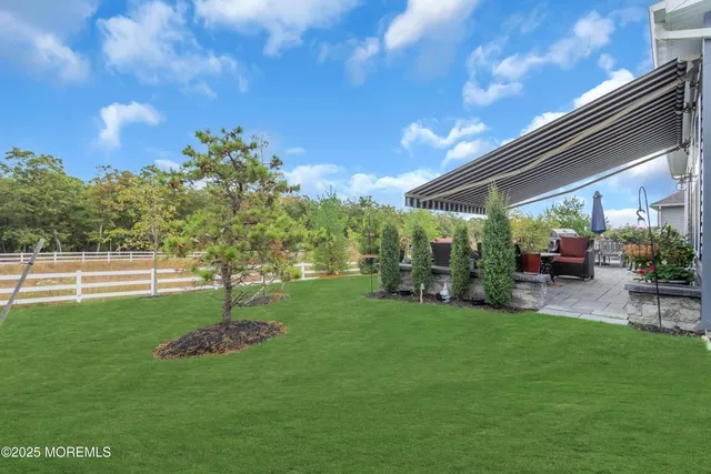 a front view of house with yard and seating area