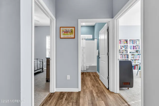 a view of a livingroom with workspace and a window