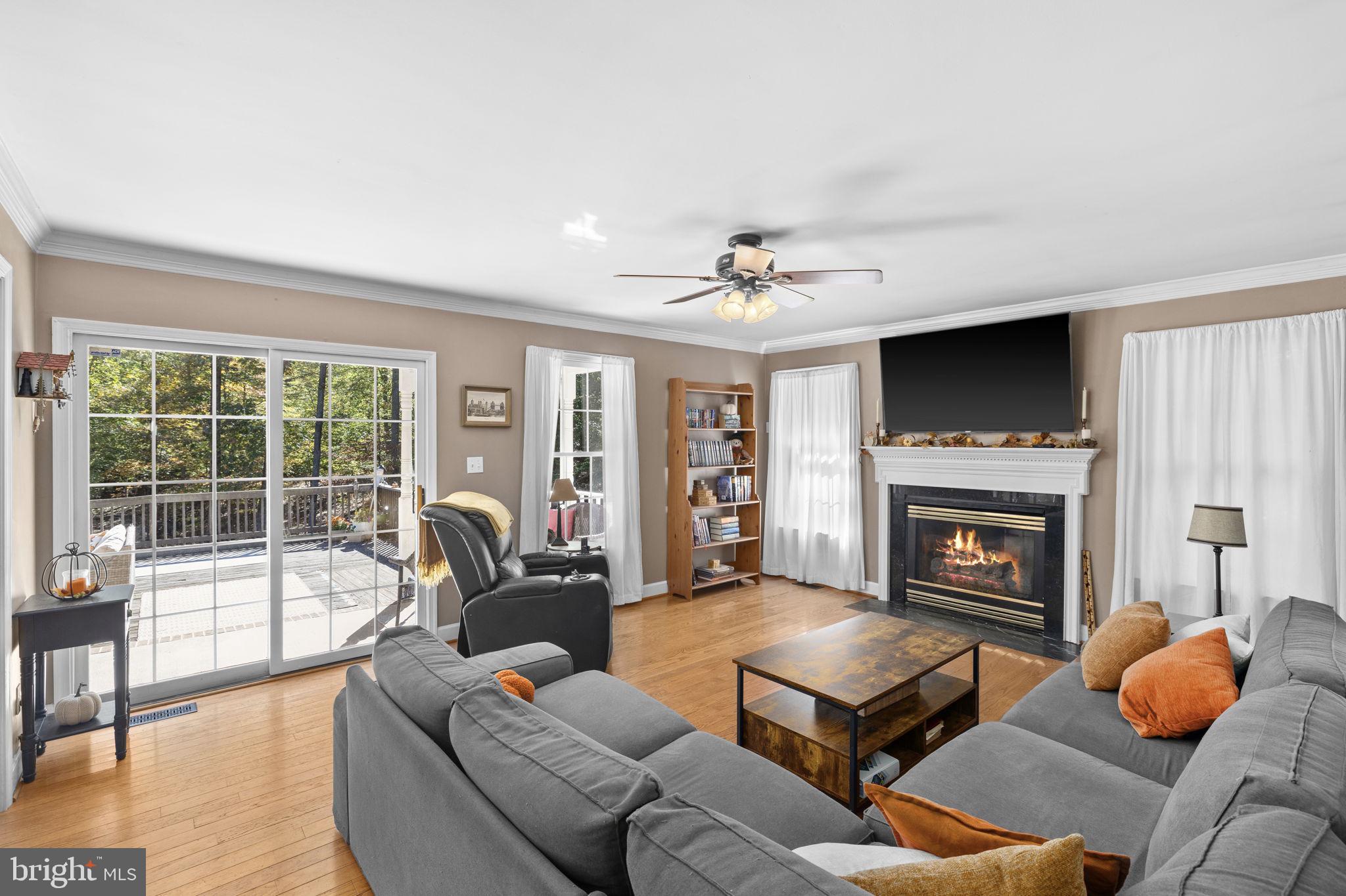 135 Old Cropps Mill Road Fredericksburg, VA 22406 - Photo 11 of 47 a living room with furniture and a fireplace
