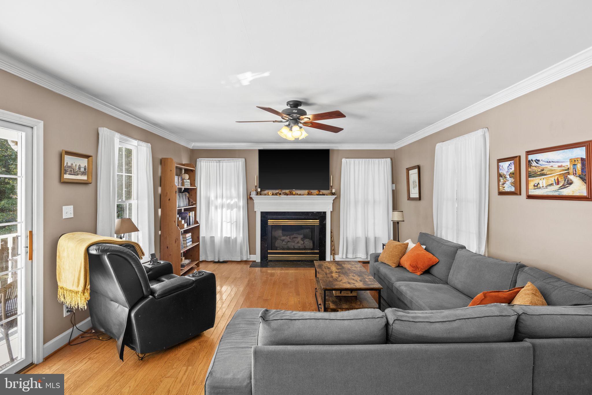 135 Old Cropps Mill Road Fredericksburg, VA 22406 - Photo 12 of 47 a living room with furniture and a fireplace