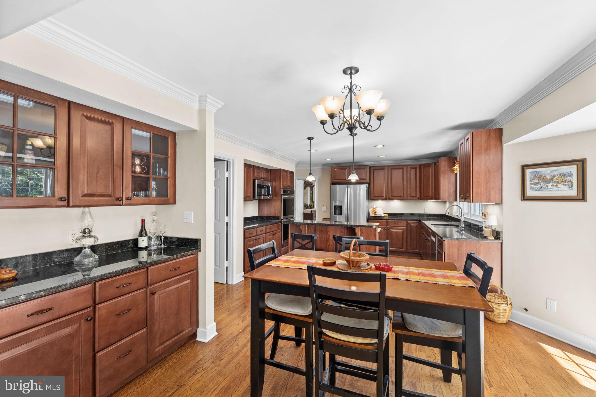 135 Old Cropps Mill Road Fredericksburg, VA 22406 - Photo 16 of 47 a large kitchen with a table and chairs