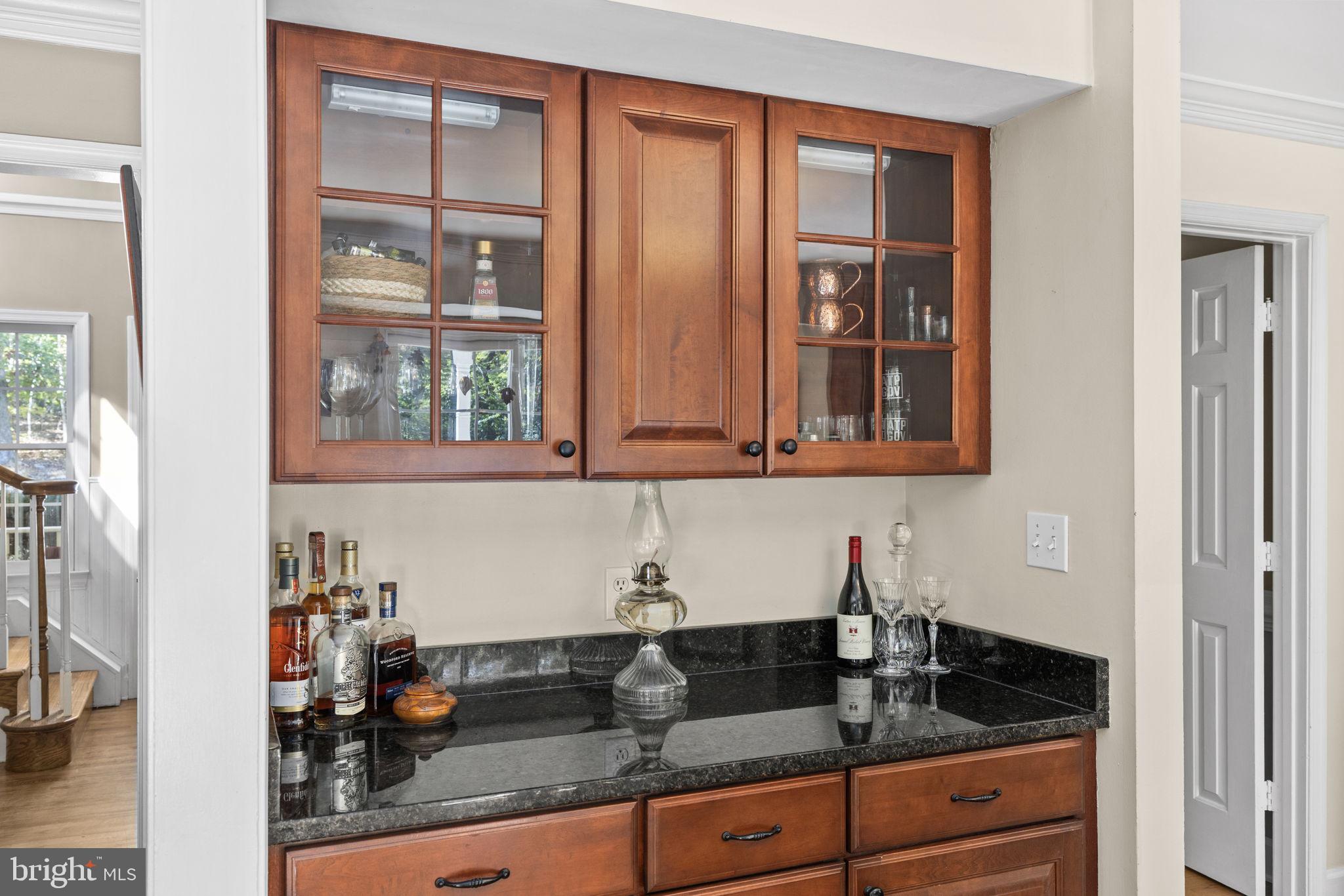 135 Old Cropps Mill Road Fredericksburg, VA 22406 - Photo 18 of 47 a kitchen with granite countertop a sink and cabinets