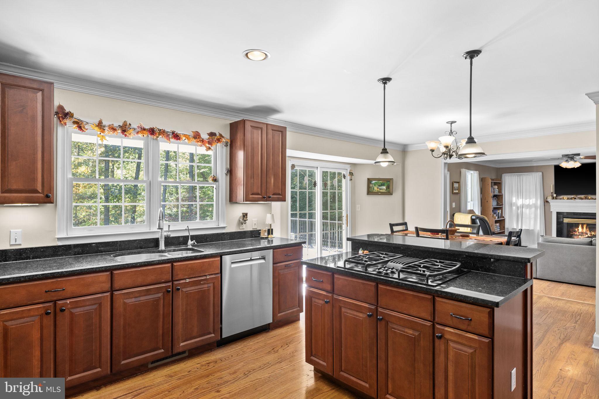 135 Old Cropps Mill Road Fredericksburg, VA 22406 - Photo 22 of 47 a kitchen with granite countertop a sink a counter space appliances and cabinets