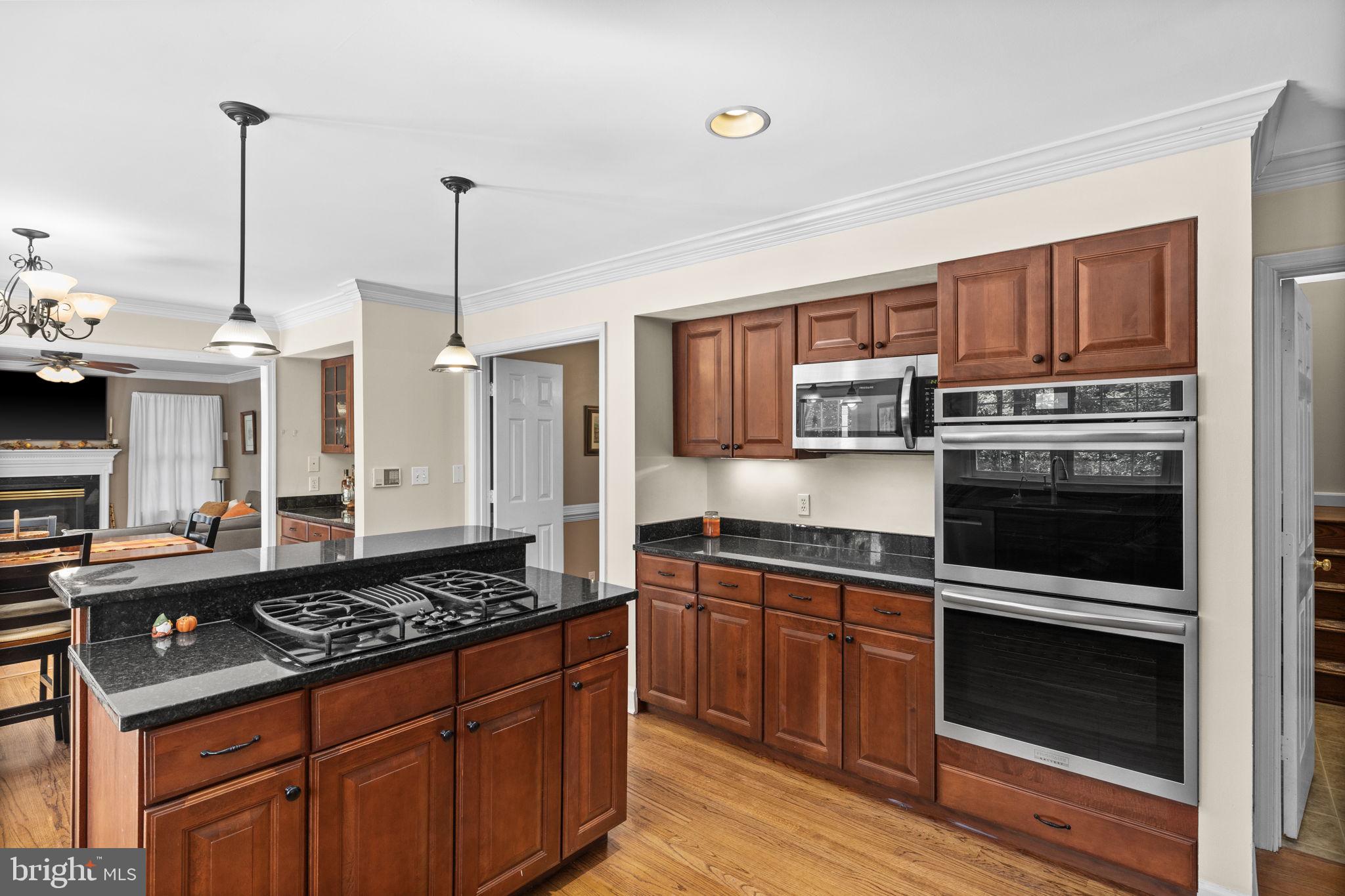 135 Old Cropps Mill Road Fredericksburg, VA 22406 - Photo 23 of 47 a kitchen with stainless steel appliances granite countertop a stove and a sink