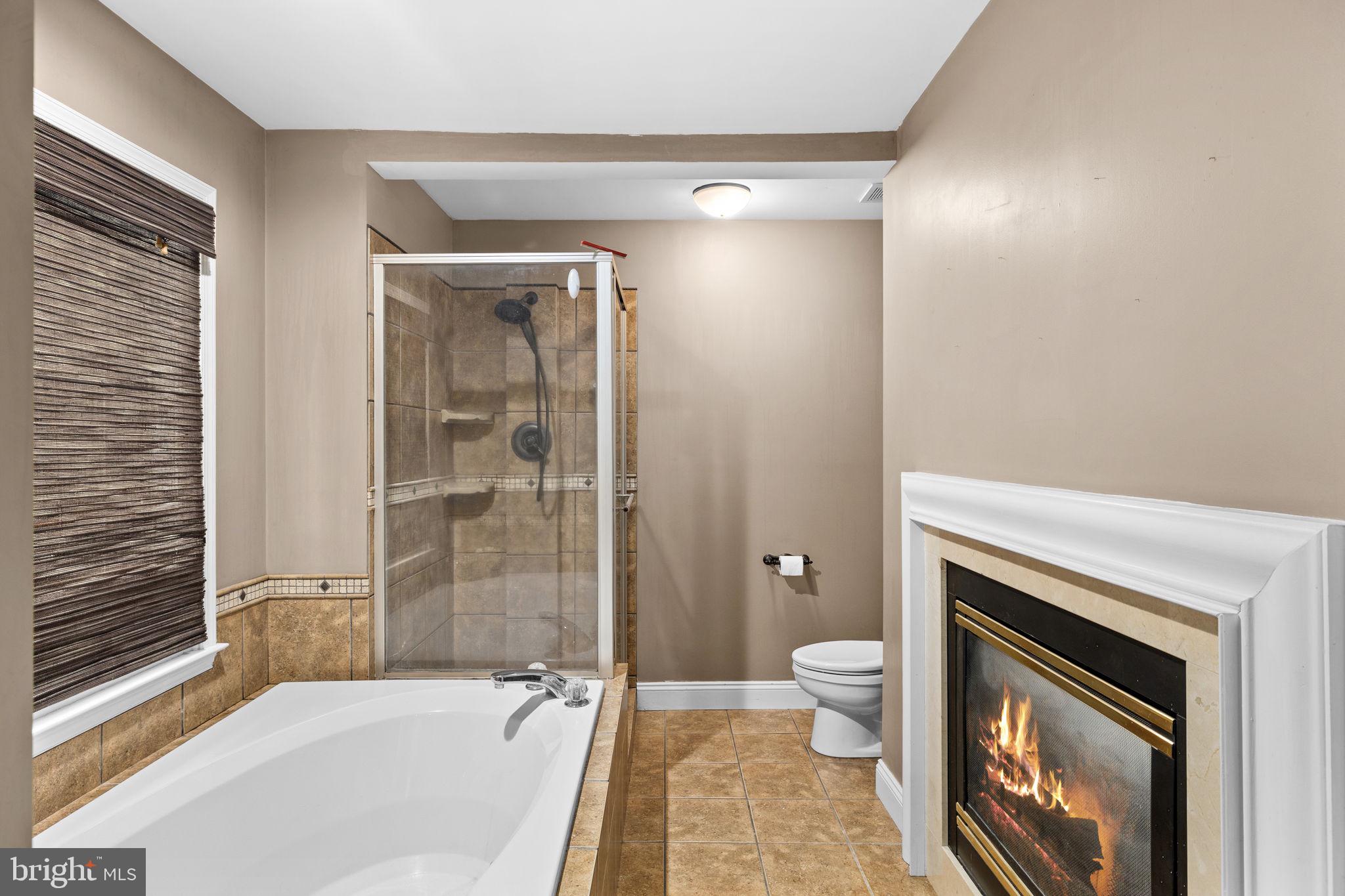 135 Old Cropps Mill Road Fredericksburg, VA 22406 - Photo 26 of 47 a bath room with a toilet and a bath tub