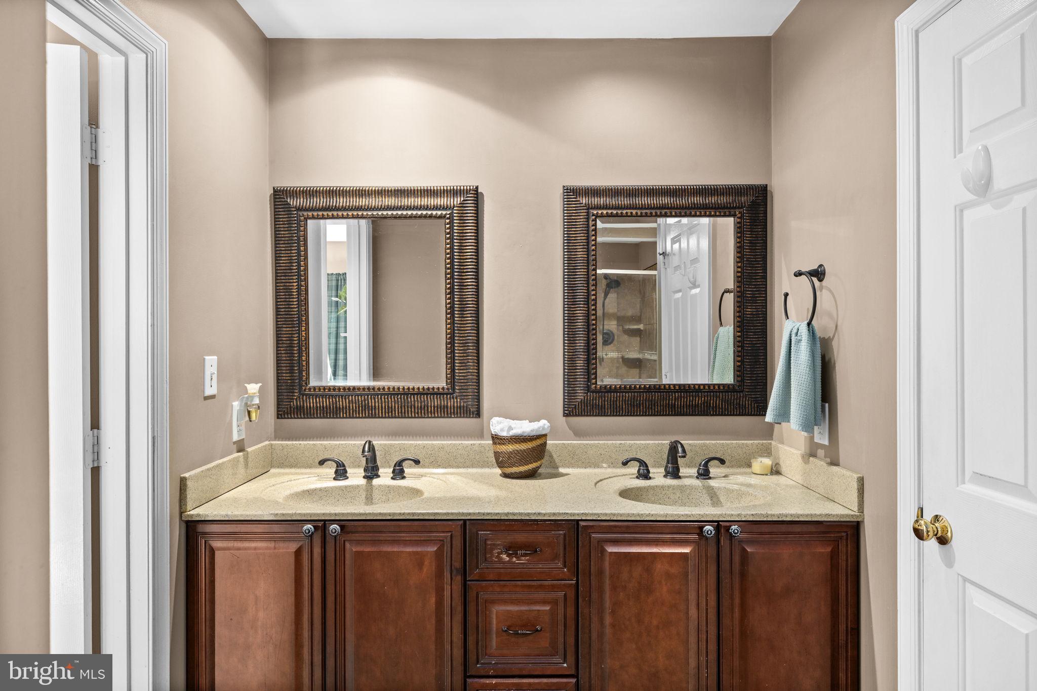 135 Old Cropps Mill Road Fredericksburg, VA 22406 - Photo 27 of 47 a bathroom with double sink and a mirror