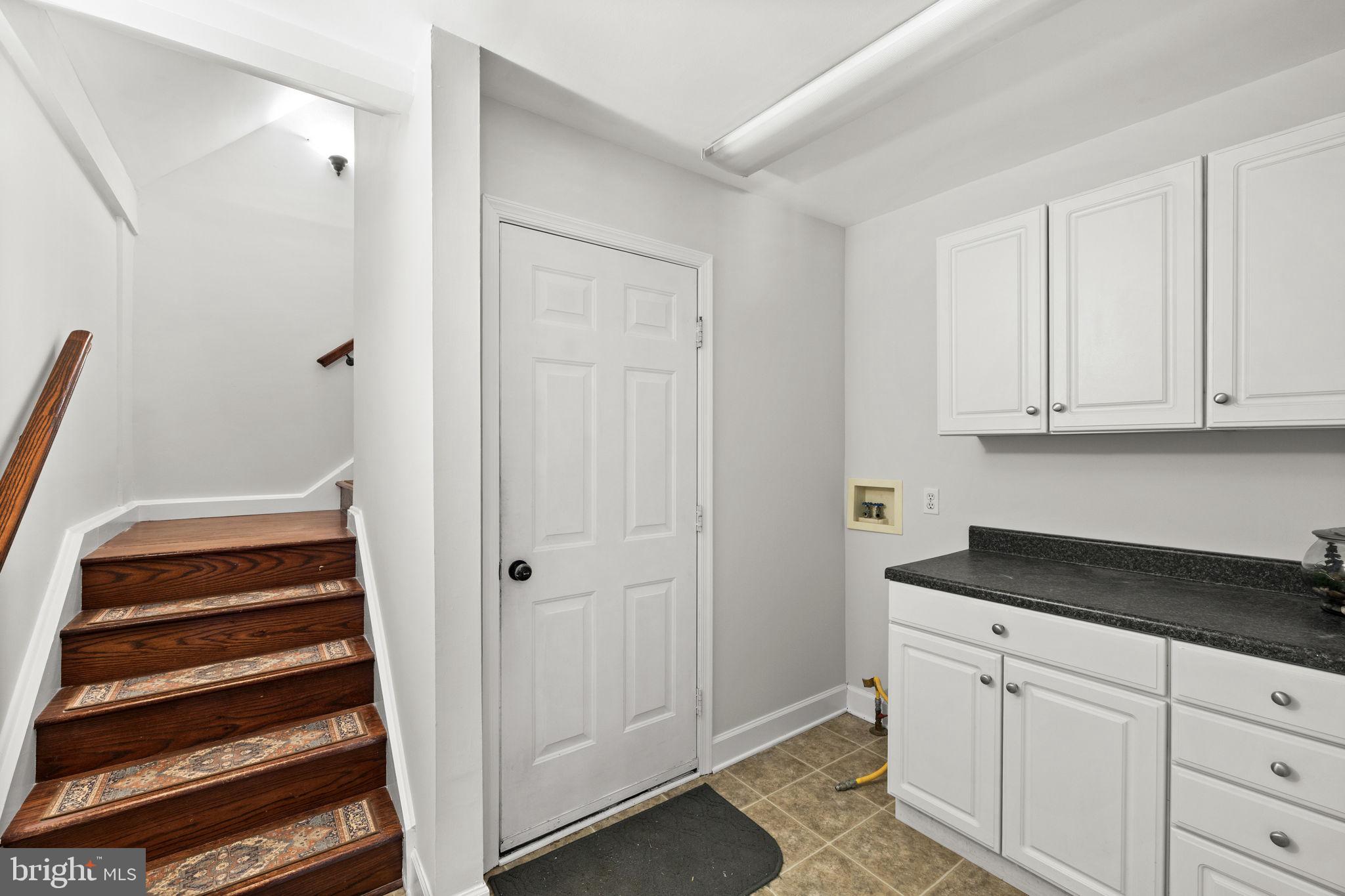 135 Old Cropps Mill Road Fredericksburg, VA 22406 - Photo 33 of 47 a view of a kitchen with white cabinets and a sink