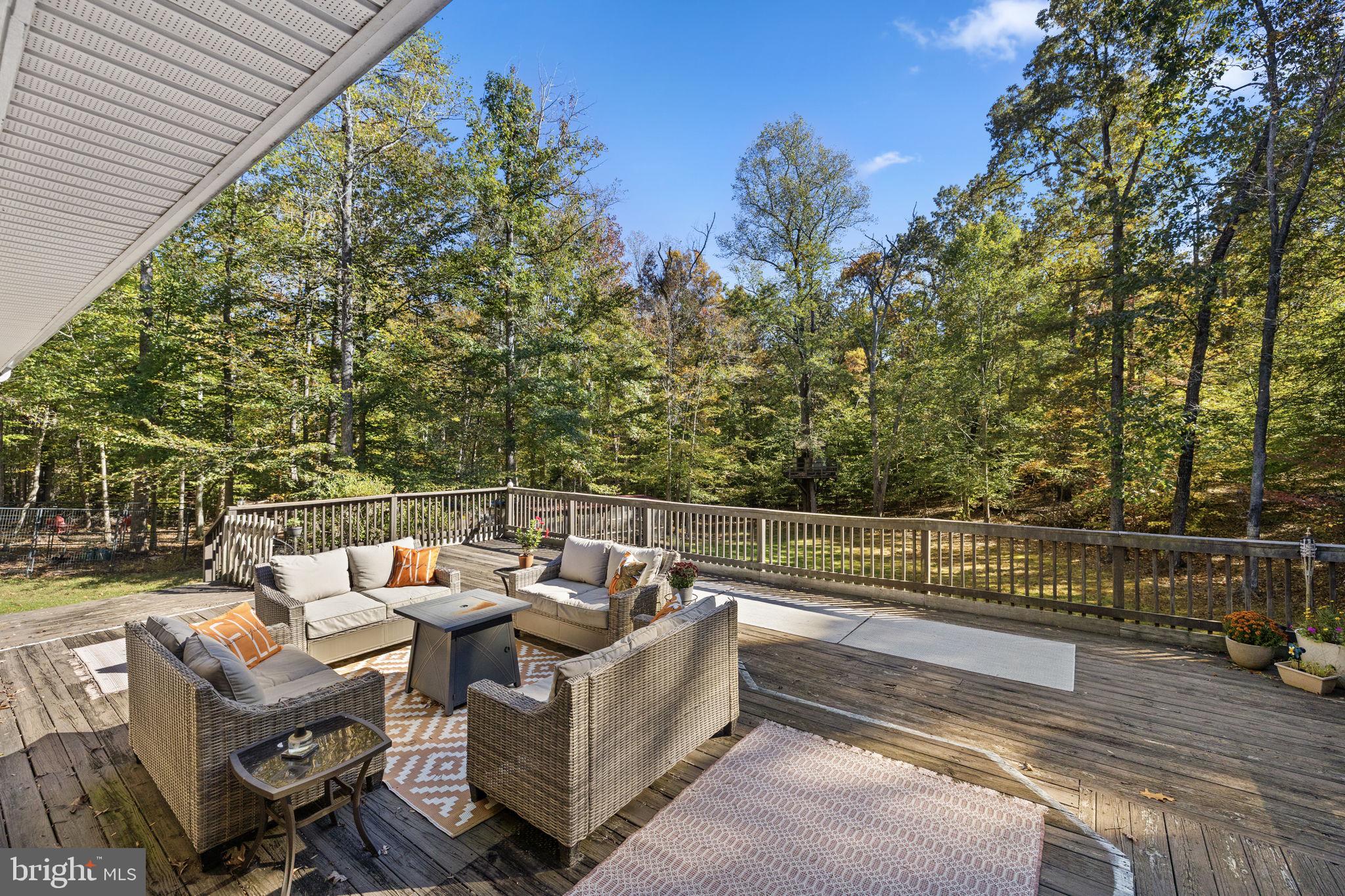 135 Old Cropps Mill Road Fredericksburg, VA 22406 - Photo 36 of 47 a view of a roof deck with couches and sky view