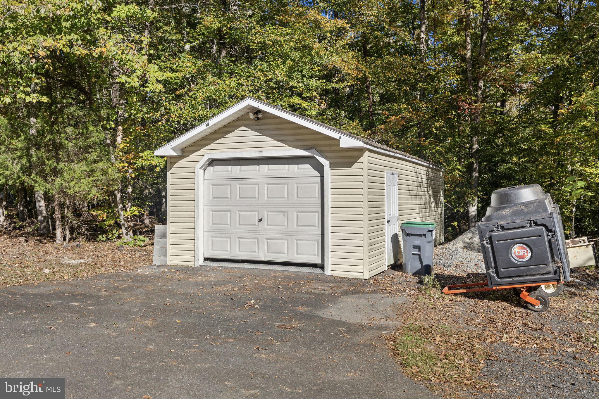 135 Old Cropps Mill Road Fredericksburg, VA 22406 - Photo 45 of 47 a view of a house with a yard and garage
