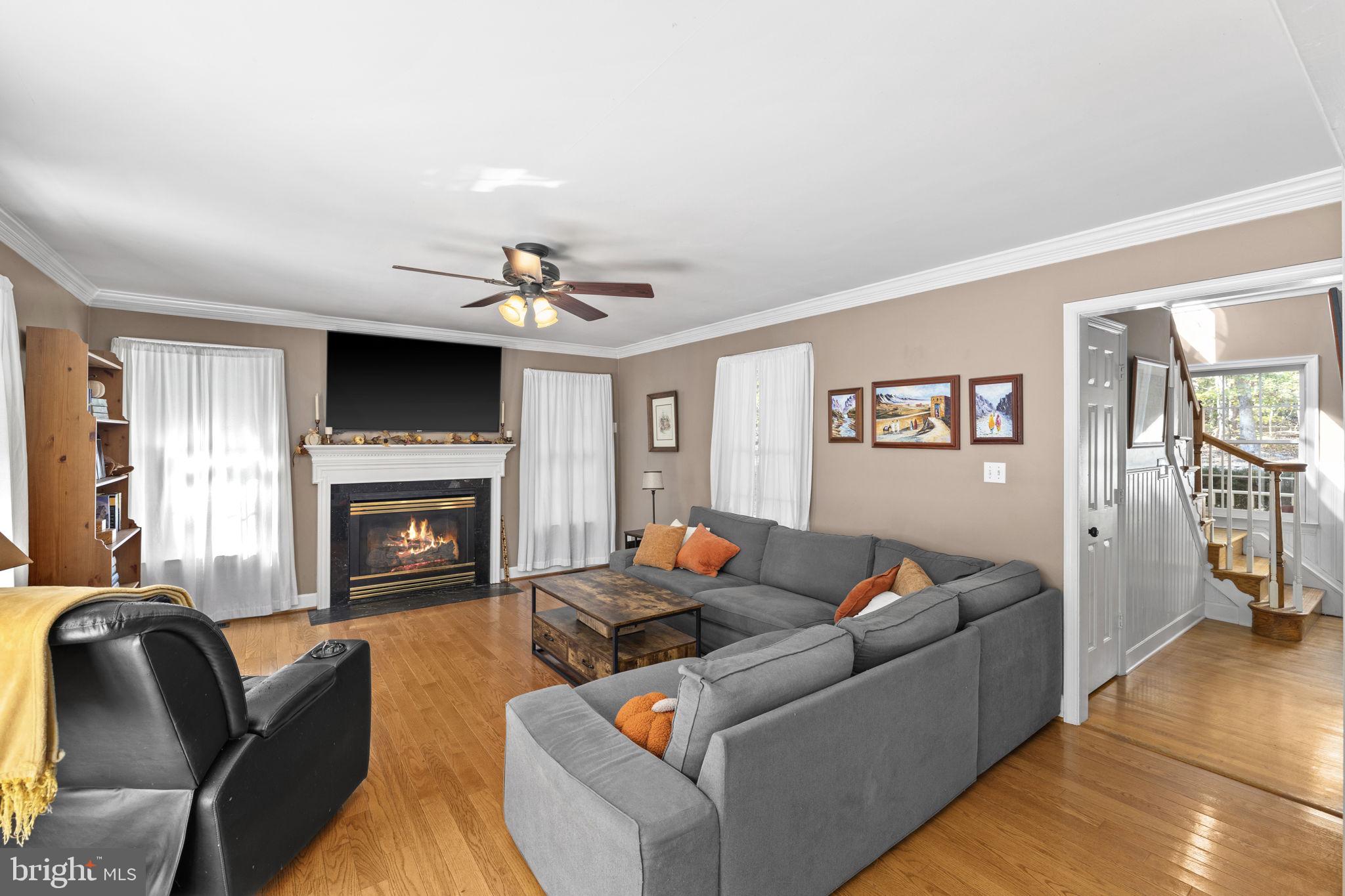 135 Old Cropps Mill Road Fredericksburg, VA 22406 - Photo 10 of 47 a living room with furniture and a fireplace