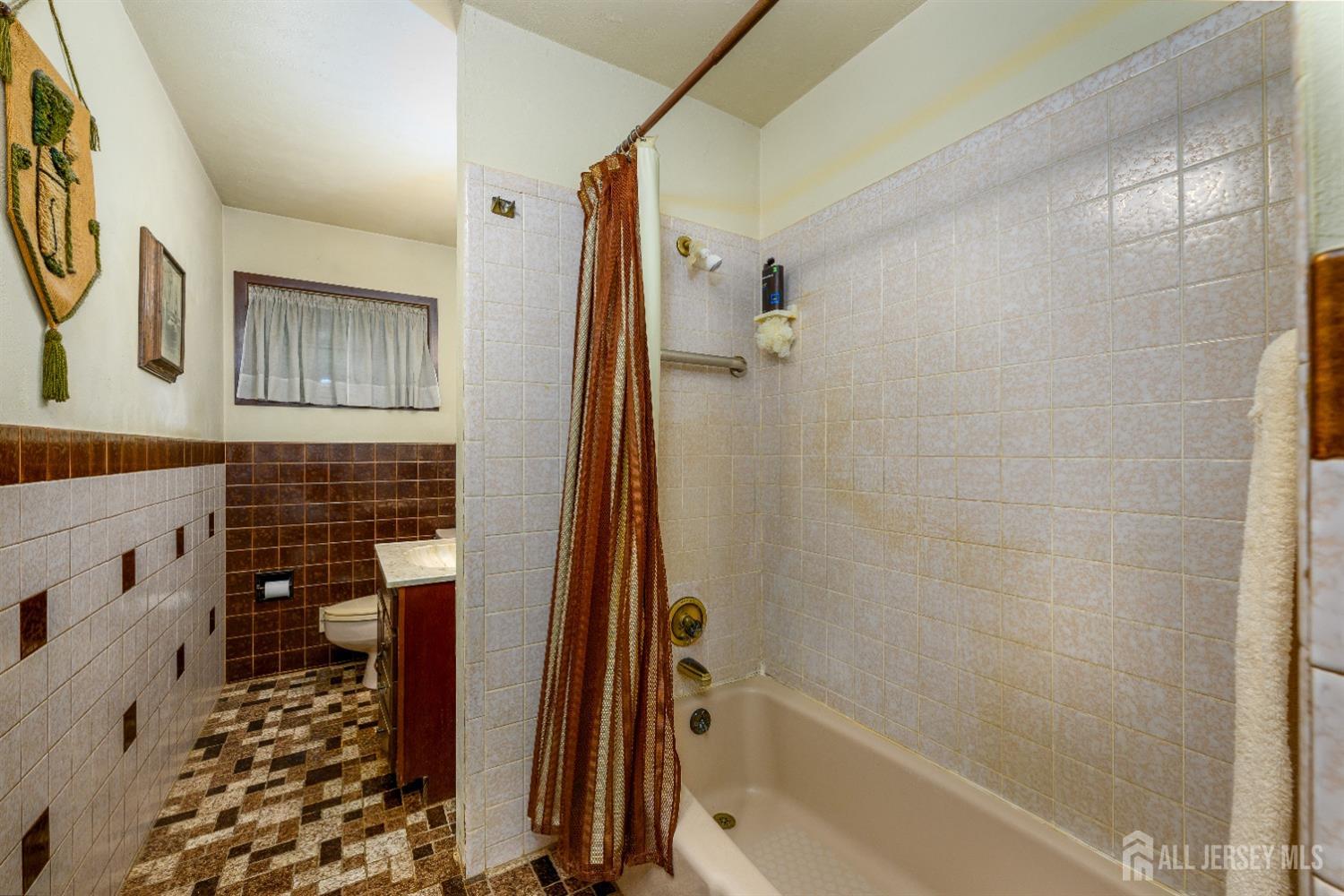 13 Brookside Road Edison, NJ 08817 - Photo 12 of 32 a bathroom with a bathtub and shower