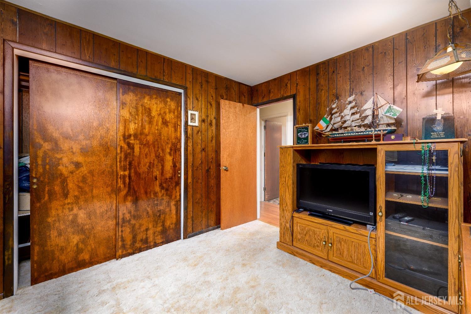 13 Brookside Road Edison, NJ 08817 - Photo 13 of 32 a view of an empty room with a fireplace and a window