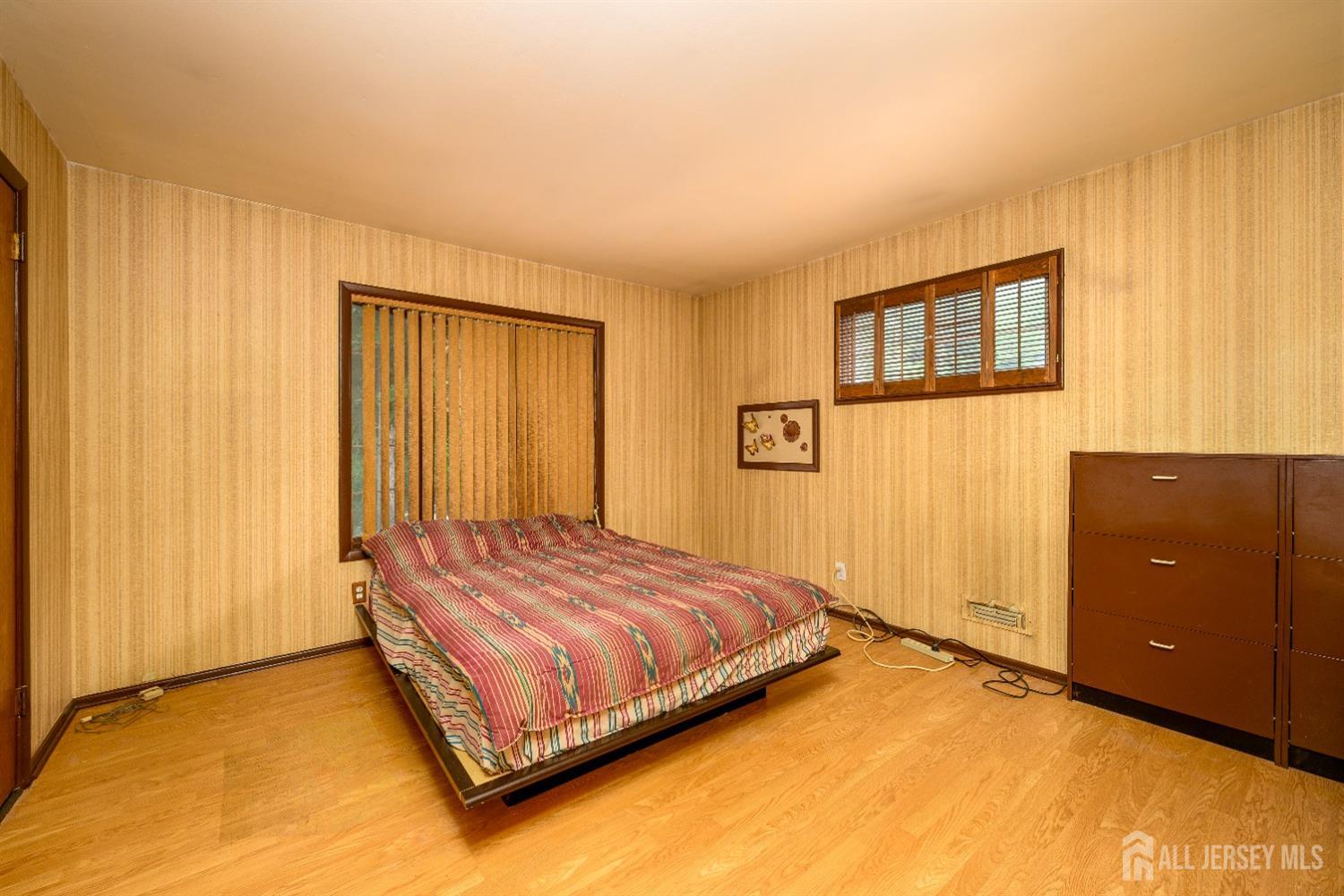 13 Brookside Road Edison, NJ 08817 - Photo 16 of 32 a bedroom with a bed and a window