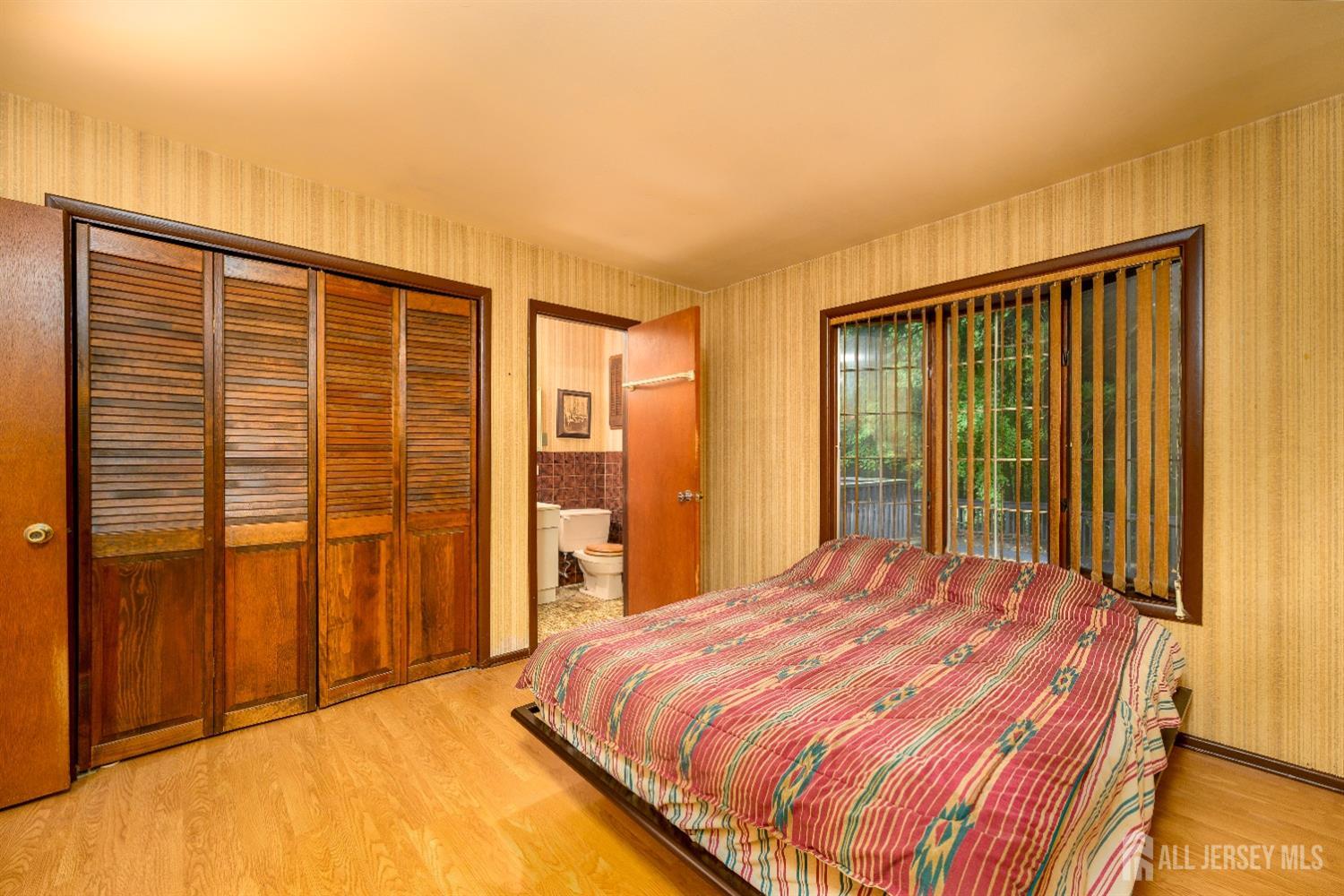 13 Brookside Road Edison, NJ 08817 - Photo 17 of 32 a bedroom with a bed and walk in closet