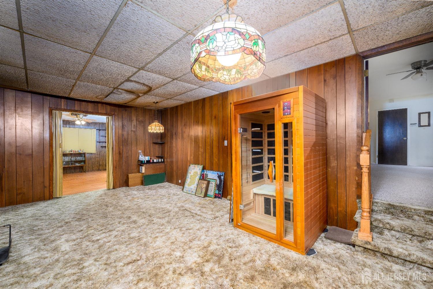 13 Brookside Road Edison, NJ 08817 - Photo 21 of 32 a view of an empty room with a chandelier fan