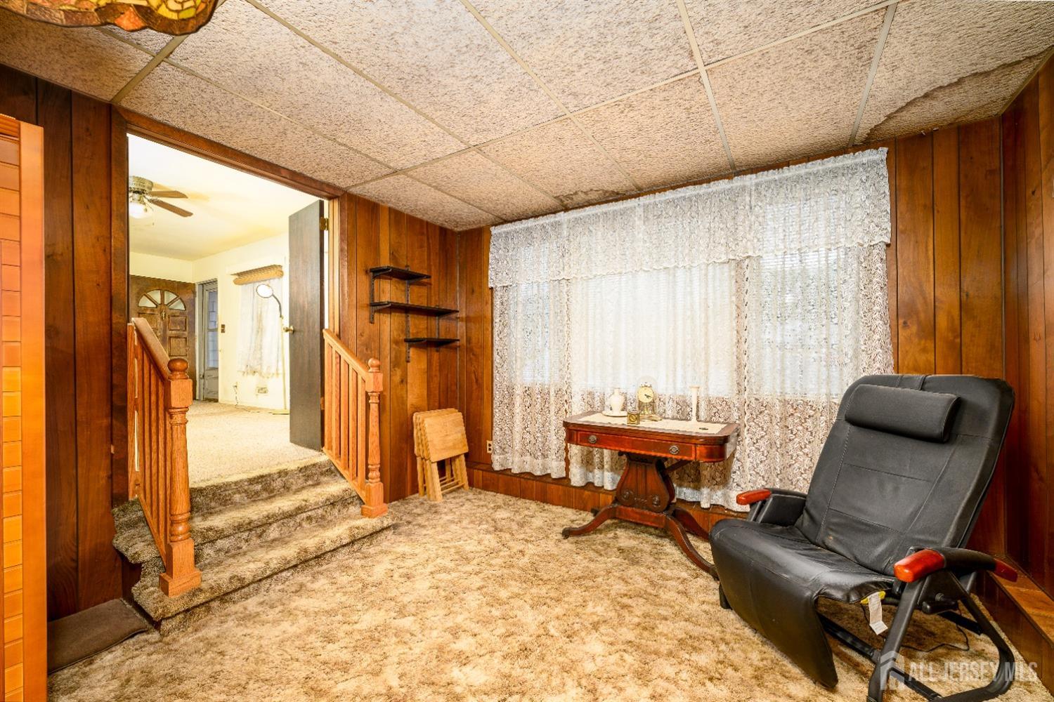 13 Brookside Road Edison, NJ 08817 - Photo 24 of 32 a living room with furniture a bed and large window