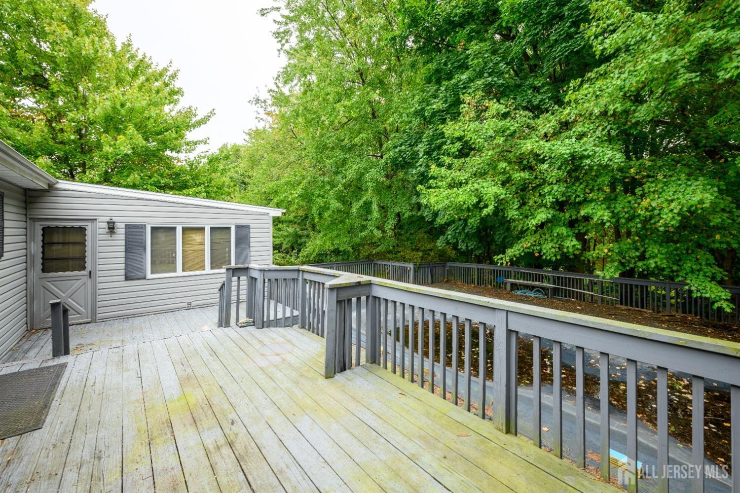 13 Brookside Road Edison, NJ 08817 - Photo 31 of 32 a view of a wooden deck and a yard