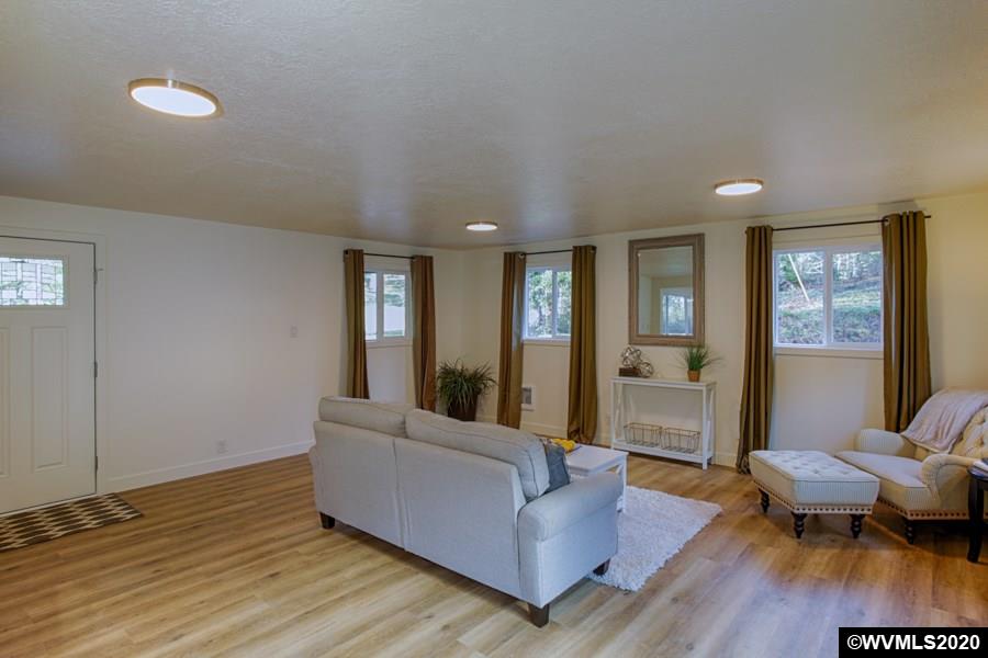 3245 Mistletoe Road Dallas, OR 97338 - Photo 7 of 28 a living room with furniture and a wooden floor